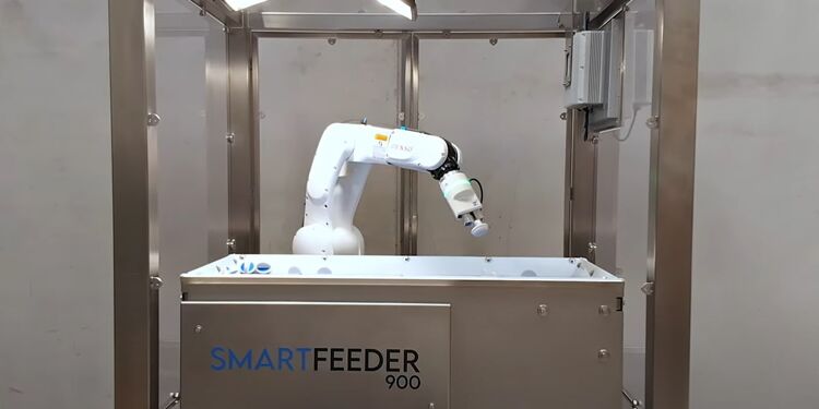 SmartFeeder 900 robotic system with integrated robotic arm in stainless steel frame